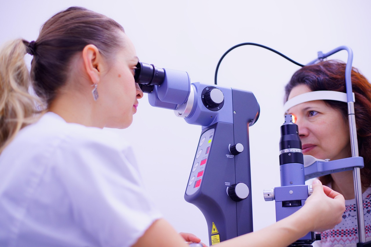 optometrist examining adult patient