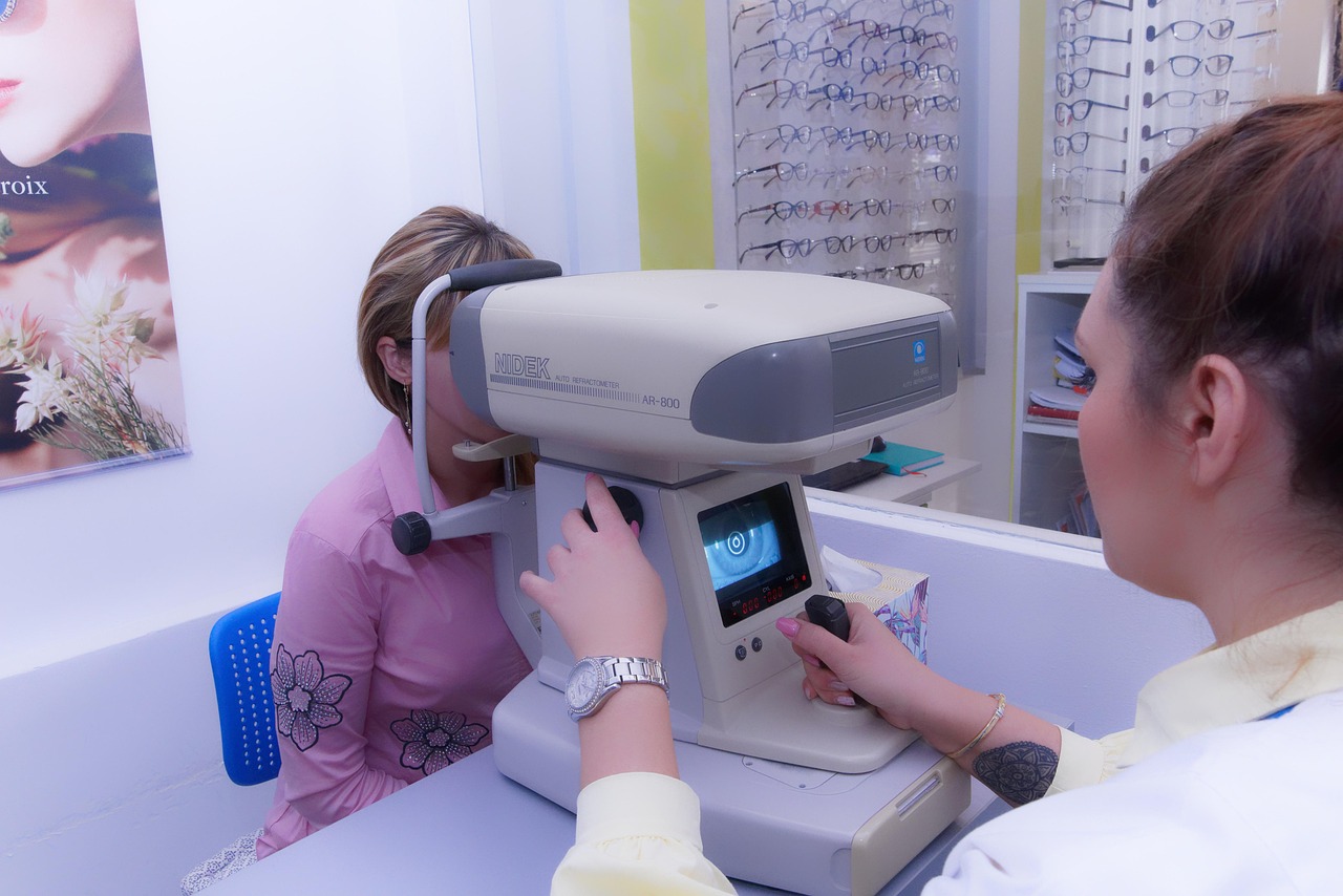 optometrist examining child in eye clinic