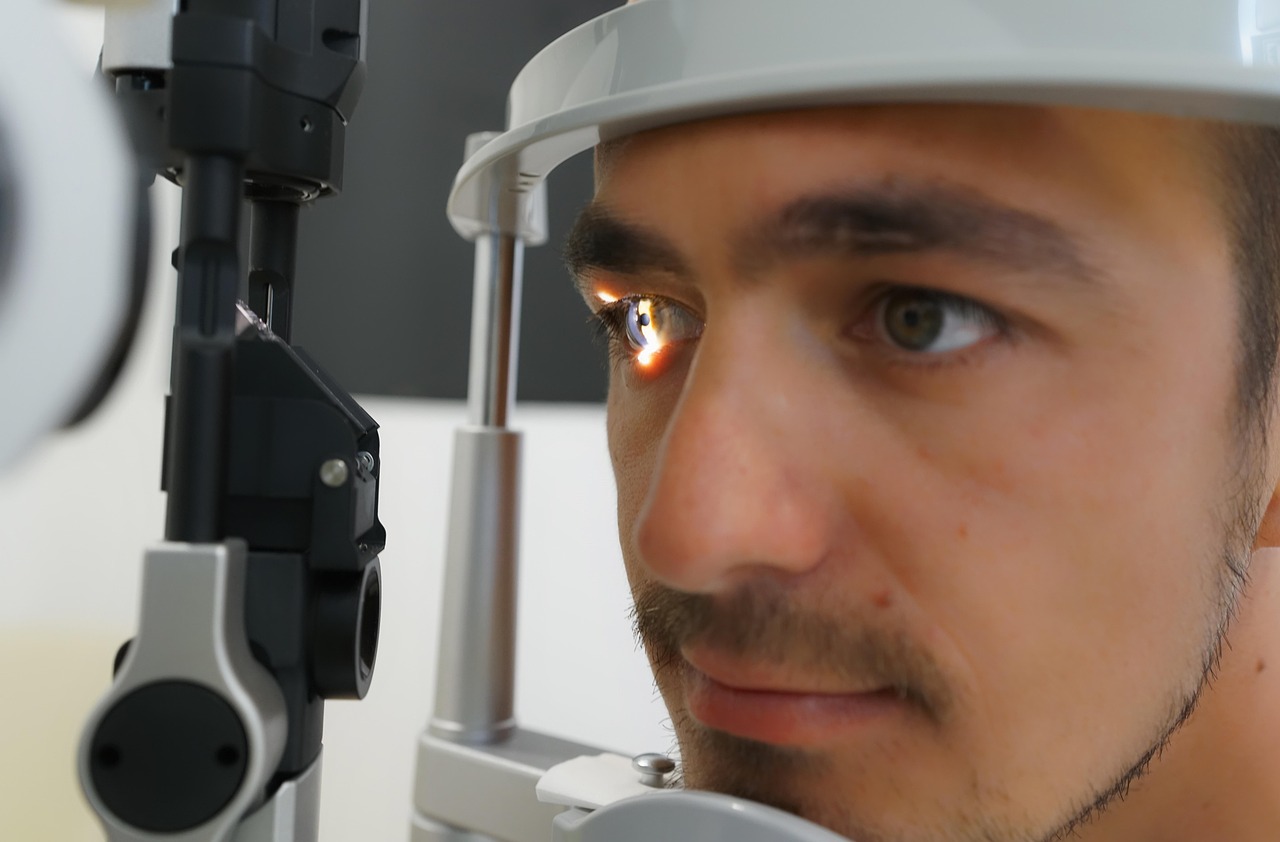 optometrist examining child in eye clinic